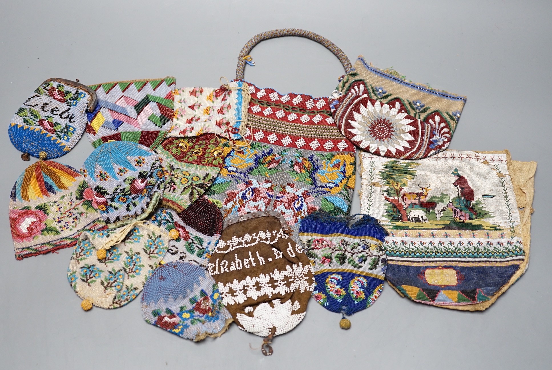 Three Victorian beadwork bags, circa 1860, largest 17cm high, and a collection of eleven smaller reticules and purses